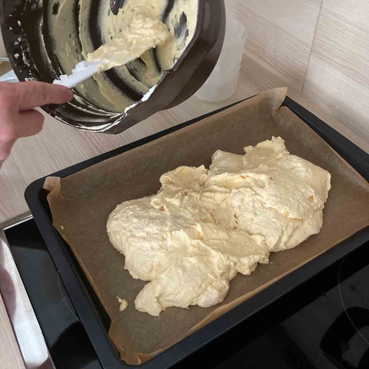 Sponge batter on baking sheet.