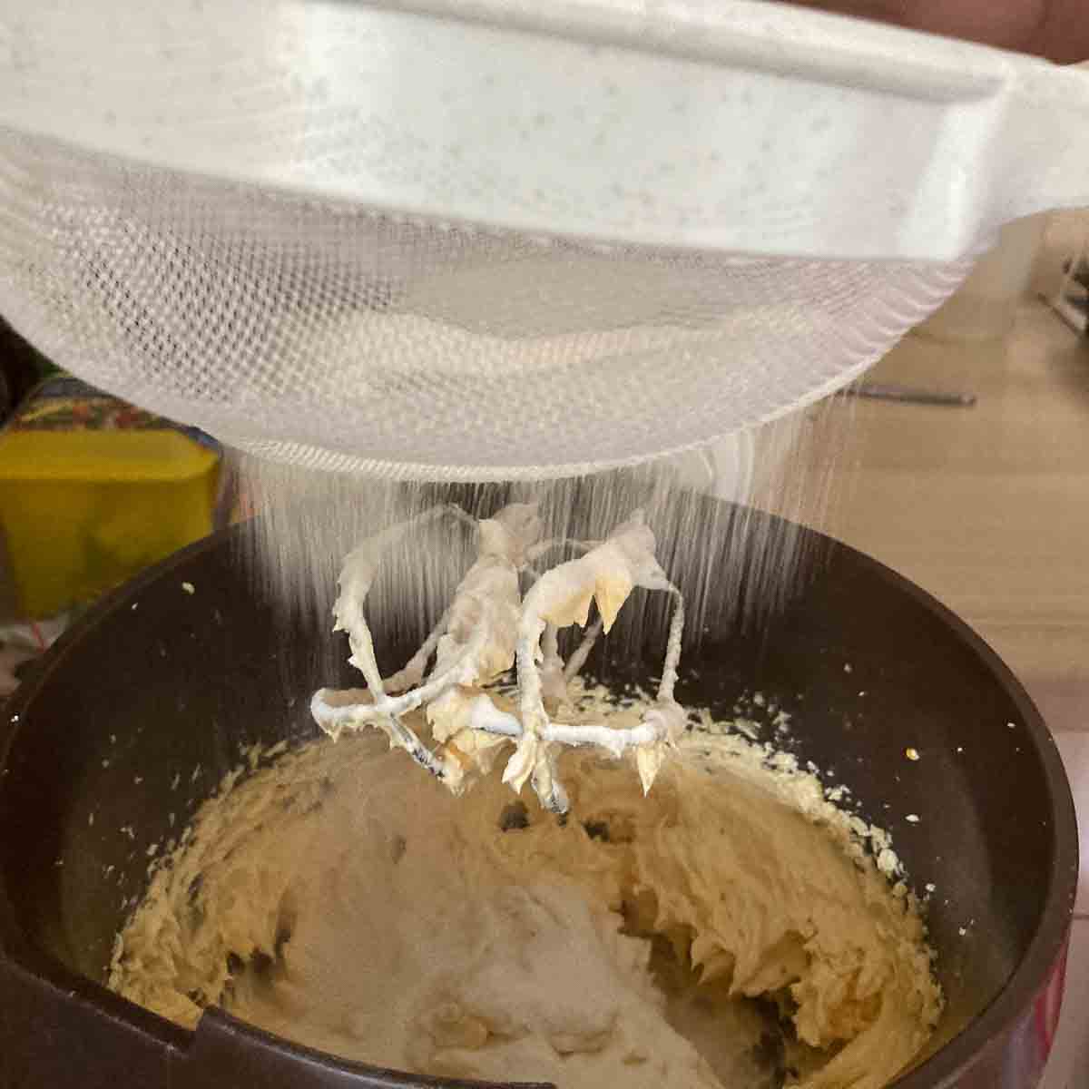 Sifting flour.