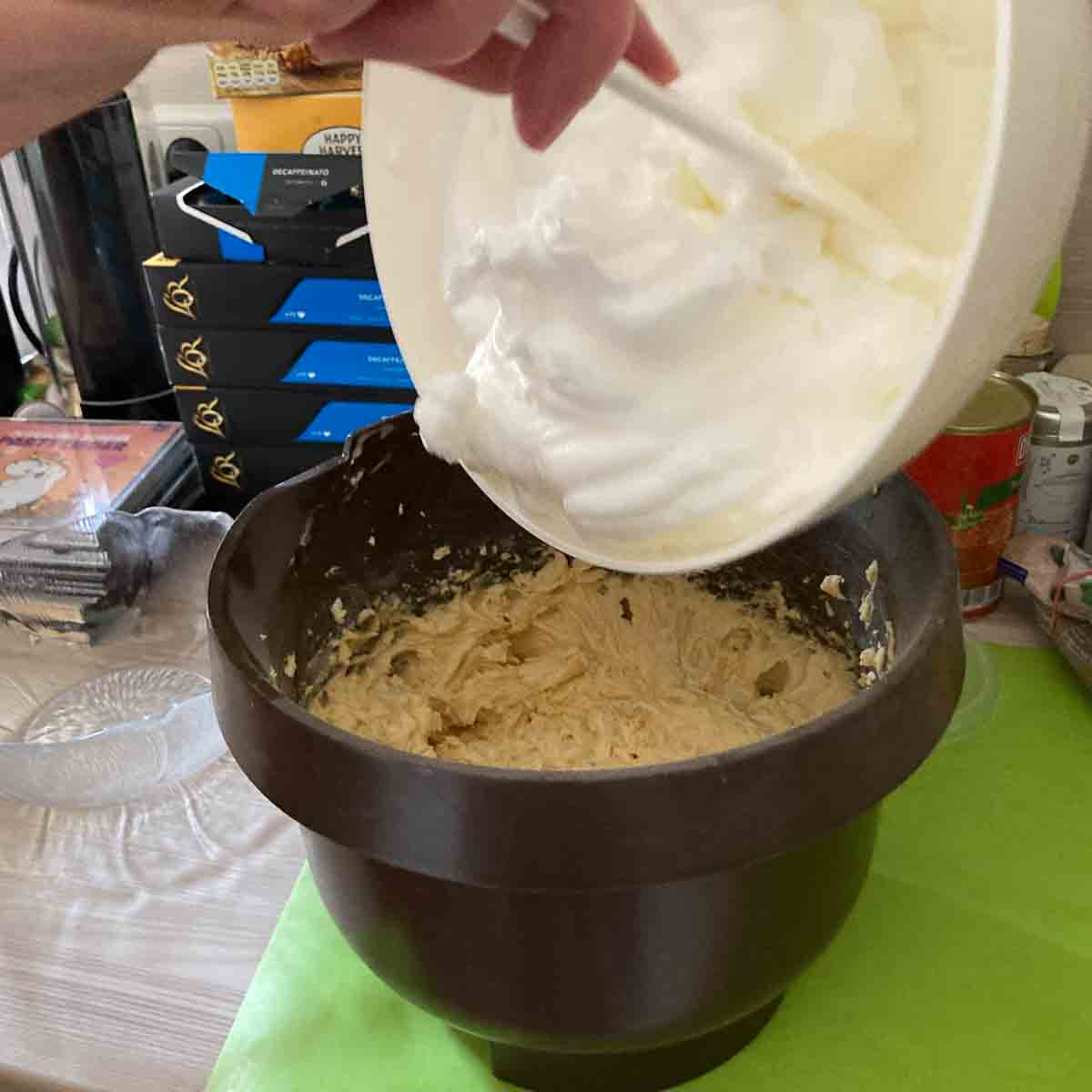 Folding in beaten egg whites.