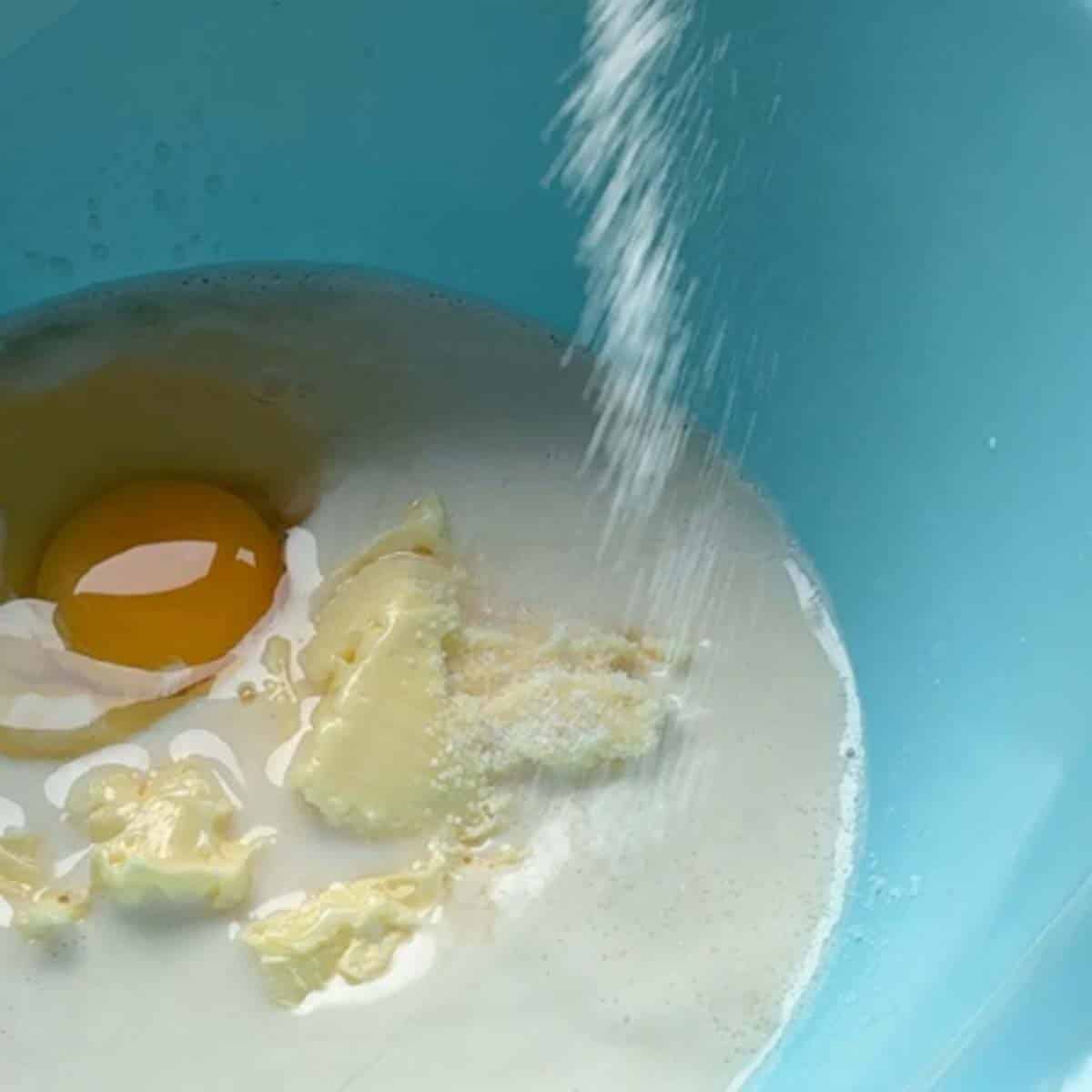 Mixing yeast dough ingredients.